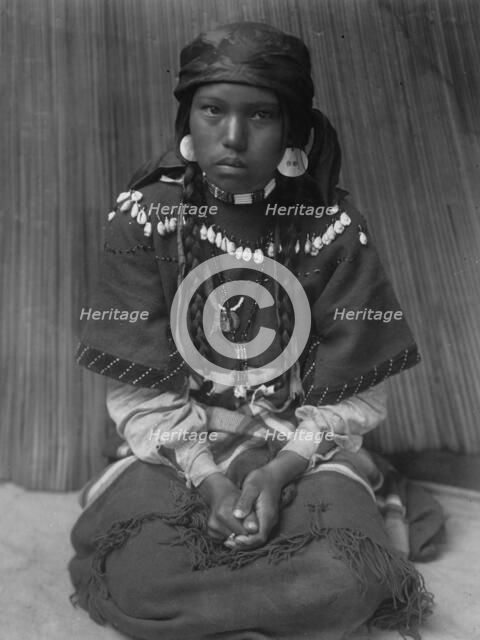 Touch her dress-Kalispel, c1910. Creator: Edward Sheriff Curtis.