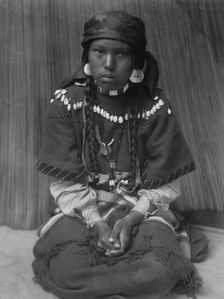 Touch her dress-Kalispel, c1910. Creator: Edward Sheriff Curtis