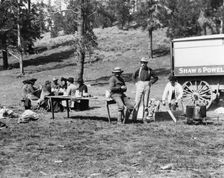 Tourists and guides picnicking in Yellowstone Park, 1903. Creator: Frances Benjamin Johnston