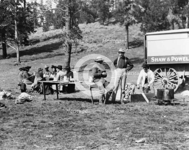 Tourists and guides picnicking in Yellowstone Park, 1903. Creator: Frances Benjamin Johnston.