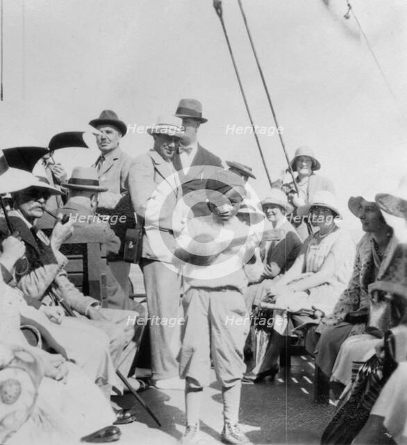 Tourists wathcing a boy playing a ukelele, Havana, Cuba, 1931. Artist: Unknown