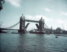 Tower Bridge with bascules raised, London, c1955. Creator: Arthur Charles Kirby Ware