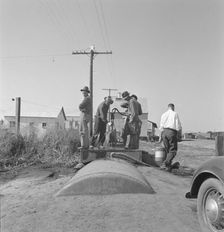 Town pump of Tulelake at railroad yard, Tulelake, Siskiyou County, California, 1939. Creator: Dorothea Lange