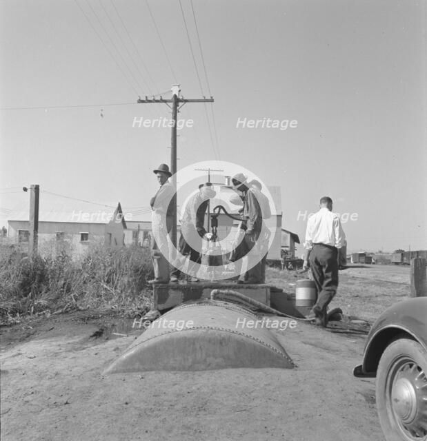 Town pump of Tulelake at railroad yard, Tulelake, Siskiyou County, California, 1939. Creator: Dorothea Lange.