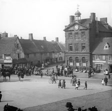 Town street scene - Plume of Feathers Inn, possible Dorset England, c1900s. Creator: Robert Augustus Henry L'Estrange