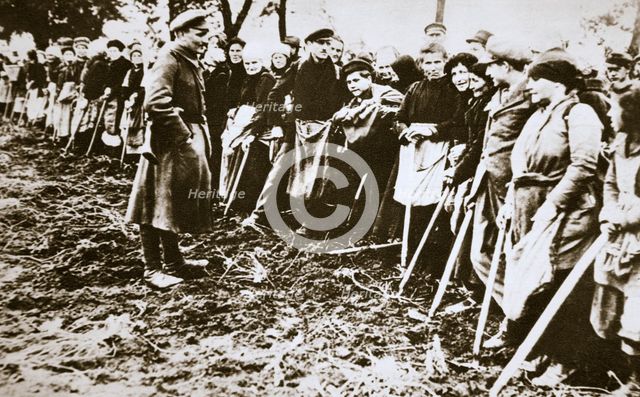 Townsfolk wait to scour the fields for potatoes left by farmers, Germany, World War I, c1914-c1918. Artist: Unknown