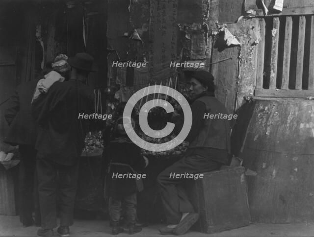 Toy merchants, Chinatown, San Francisco, between 1896 and 1906. Creator: Arnold Genthe.