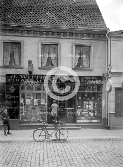 Tobacconist's and horologist's shops, Landskrona, Sweden, 1920. Creator: Unknown.