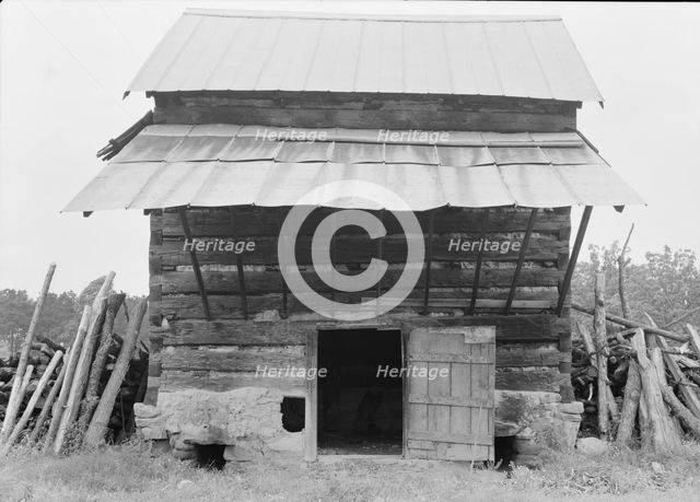 Tobacco barn with front shelter, Olive Hill, North Carolina, 1939. Creator: Dorothea Lange.