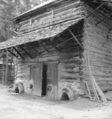 Tobacco barn with newly plastered furnace..., Person County, North Carolina, 1939. Creator: Dorothea Lange