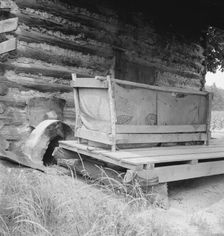 Tobacco barn with tobacco sled and vehicle used..., Person County, North Carolina, 1939. Creator: Dorothea Lange