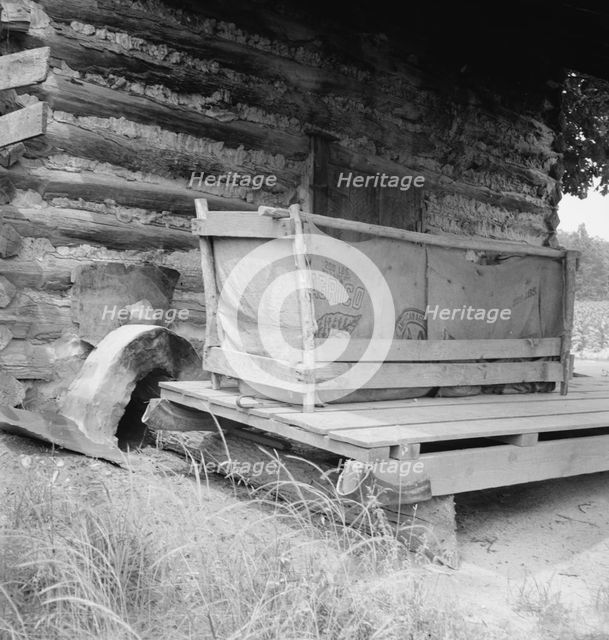 Tobacco barn with tobacco sled and vehicle used..., Person County, North Carolina, 1939. Creator: Dorothea Lange.