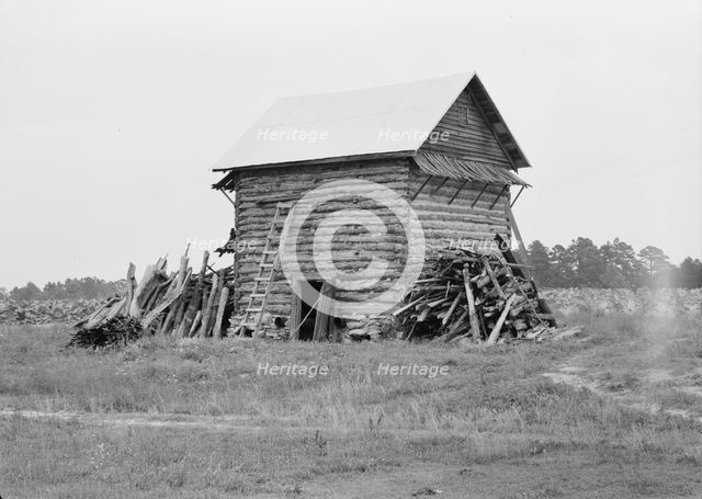 Tobacco barn without front shelter, Person County, North Carolina, 1939. Creator: Dorothea Lange.
