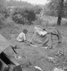 Tobacco sharecropper child playing, Person County, North Carolina, 1939. Creator: Dorothea Lange