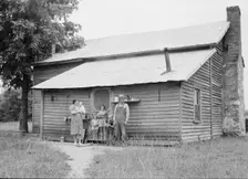 Tobacco sharecropper and his family at the back..., Person County, North Carolina, 1939. Creator: Dorothea Lange
