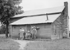 Tobacco sharecropper and his family at the back..., Person County, North Carolina, 1939. Creator: Dorothea Lange
