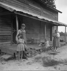 Tobacco sharecropper with his oldest daughter, Person County, North Carolina, 1939. Creator: Dorothea Lange
