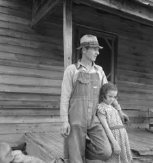Tobacco sharecropper with his oldest daughter, Person County, North Carolina, 1939. Creator: Dorothea Lange