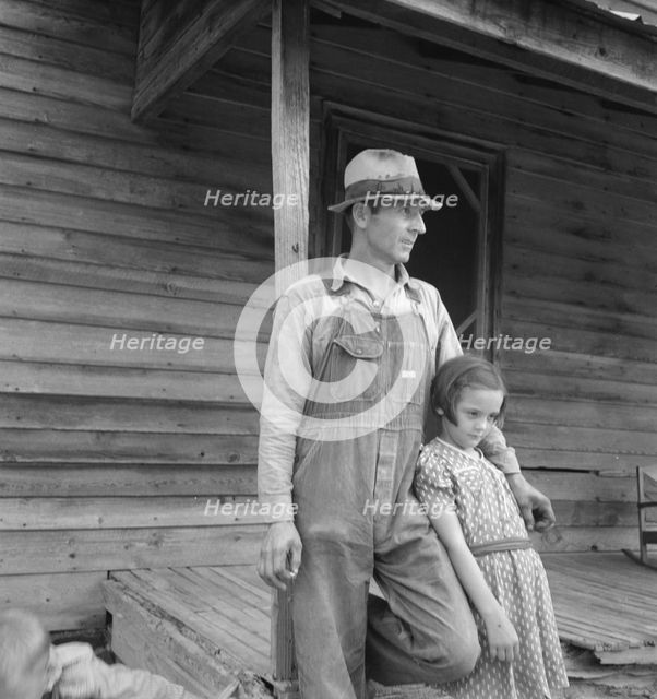 Tobacco sharecropper with his oldest daughter, Person County, North Carolina, 1939. Creator: Dorothea Lange.