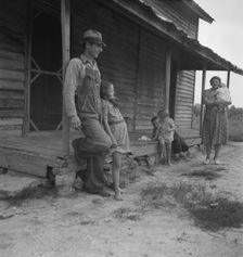 Tobacco sharecropper with his oldest daughter, Person County, North Carolina, 1939. Creator: Dorothea Lange