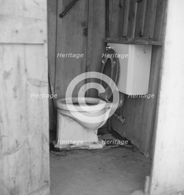 Toilet for ten cabins, men, women...in auto camp..., Greenfield, Salinas Valley, CA, 1939. Creator: Dorothea Lange.