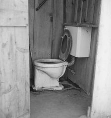 Toilet for ten cabins, men, women...in auto camp..., Greenfield, Salinas Valley, CA, 1939. Creator: Dorothea Lange