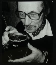 Tom Burnham with a pint at The Bell, Codicote, Hertfordshire, December 1986. Creator: Denis Williams