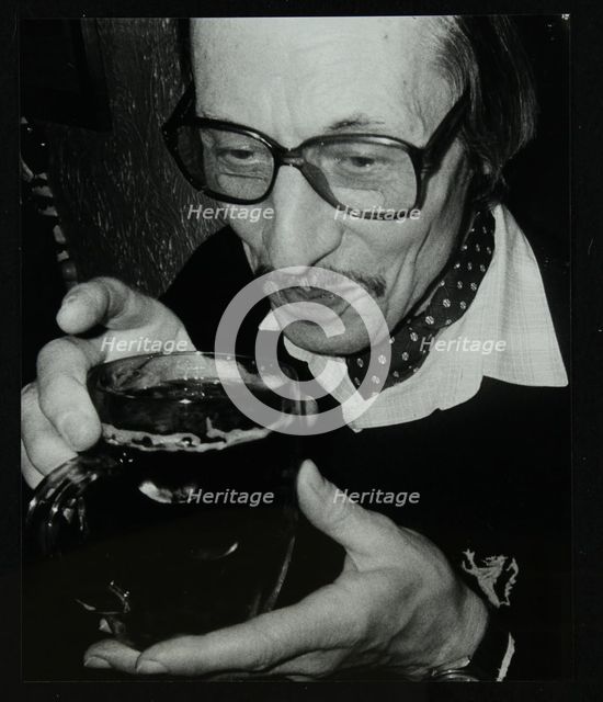 Tom Burnham with a pint at The Bell, Codicote, Hertfordshire, December 1986. Creator: Denis Williams.