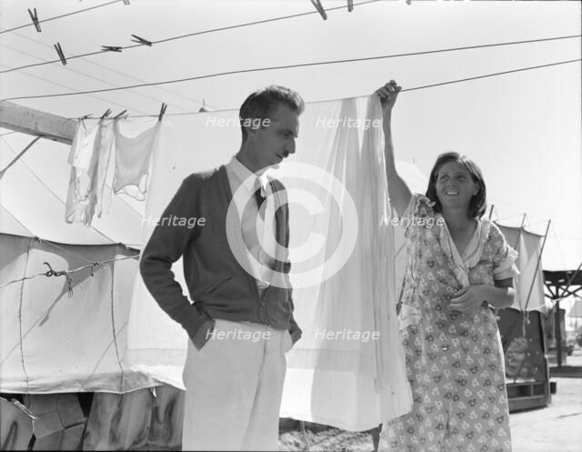 Tom Collins, manager of Kern migrant camp, talking with one of the members, California, 1936. Creator: Dorothea Lange.