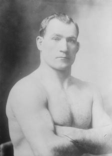 Tom Sharkey without shirt, 1910. Creator: Bain News Service