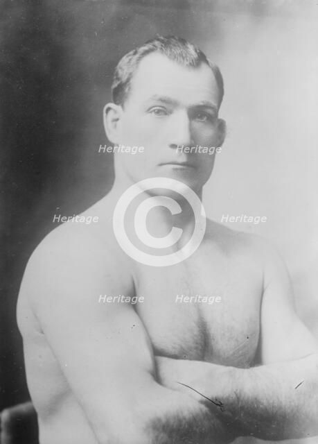 Tom Sharkey without shirt, 1910. Creator: Bain News Service.