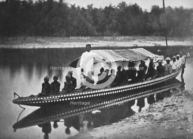 'Tom West India's' canoe, New Calabar, Southern Nigeria, 1912. Artist: Unknown.