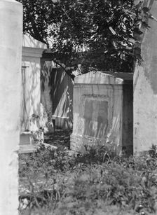 Tomb in St. Louis Cemetery, New Orleans, between 1920 and 1926. Creator: Arnold Genthe