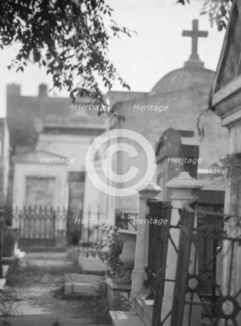 Tombs in St. Louis Cemetery, New Orleans, between 1920 and 1926. Creator: Arnold Genthe.