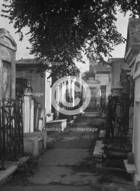 Tombs in St. Louis Cemetery, New Orleans, between 1920 and 1926. Creator: Arnold Genthe.