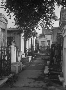 Tombs in St. Louis Cemetery, New Orleans, between 1920 and 1926. Creator: Arnold Genthe