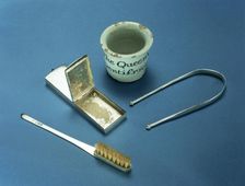 Toothbrush, box of dental powder and tongue-scraper, 18th century