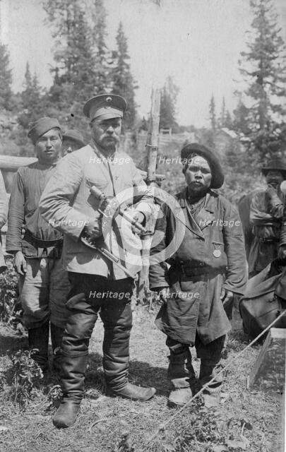 Topographer, a Member of the Land-Management Expedition with the Village Headman, 1913. Creator: GI Ivanov.