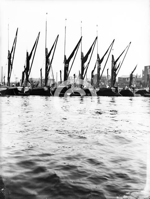 Topsail barges at anchor on the Thames, some with topsails lowered, London, c1905. Artist: Unknown