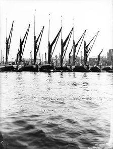 Topsail barges at anchor on the Thames, some with topsails lowered, London, c1905