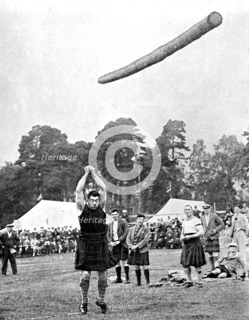 Tossing the caber at the Highland games, Scotland, 1936. Artist: Fox