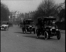 Taxis Drive Down a London Street, 1924. Creator: British Pathe Ltd