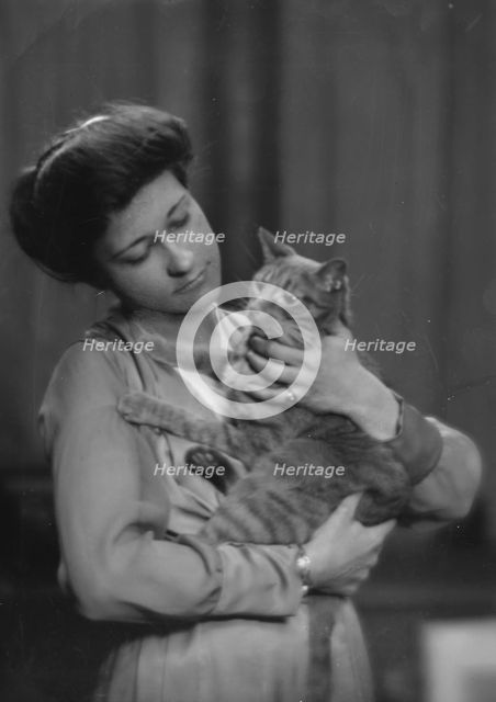 Taylor, A., Miss, with Buzzer the cat, portrait photograph, 1916 Mar. 2. Creator: Arnold Genthe.