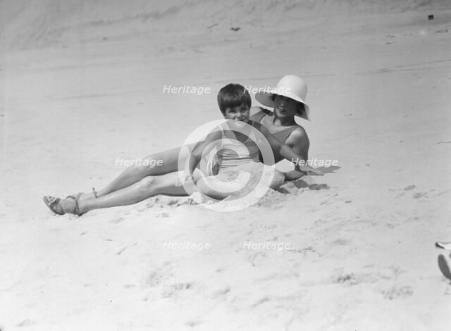Taylor, Fenton, Mrs., and child, at the beach, 1931 Creator: Arnold Genthe.