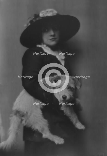 Taylor, Laurette, Miss, with dog, portrait photograph, 1913. Creator: Arnold Genthe.