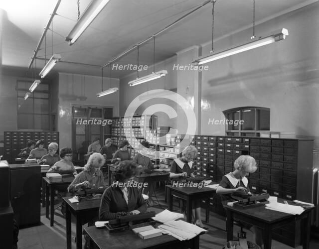 Tabulating machines in the punch room in a Sheffield Factory office, 1963.  Artist: Michael Walters