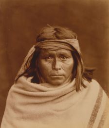 Tah-Lay, Apache? Indian, head-and-shoulders portrait, facing front, wearing blanket and..., c1903. Creator: Edward Sheriff Curtis