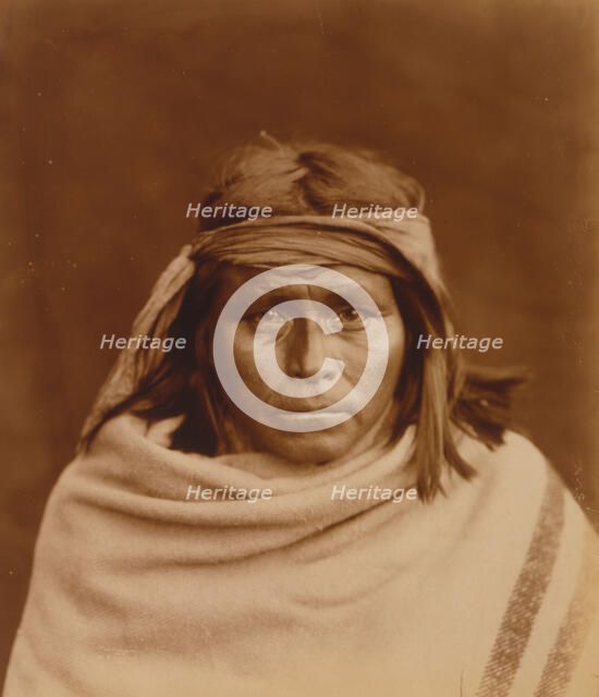 Tah-Lay, Apache? Indian, head-and-shoulders portrait, facing front, wearing blanket and..., c1903. Creator: Edward Sheriff Curtis.