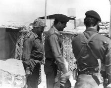 Taha Yassin Ramadan and Saddam Hussein inspecting the Basra front, Iraq, February 1987