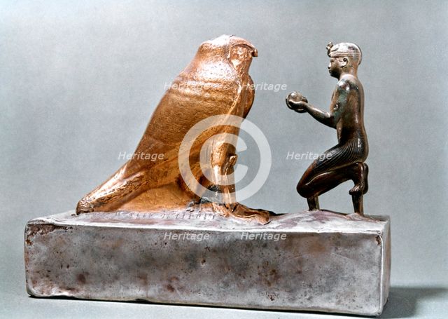 Taharqa in front of the falcon Hemen, Ancient Egyptian, 7th century BC. Artist: Unknown